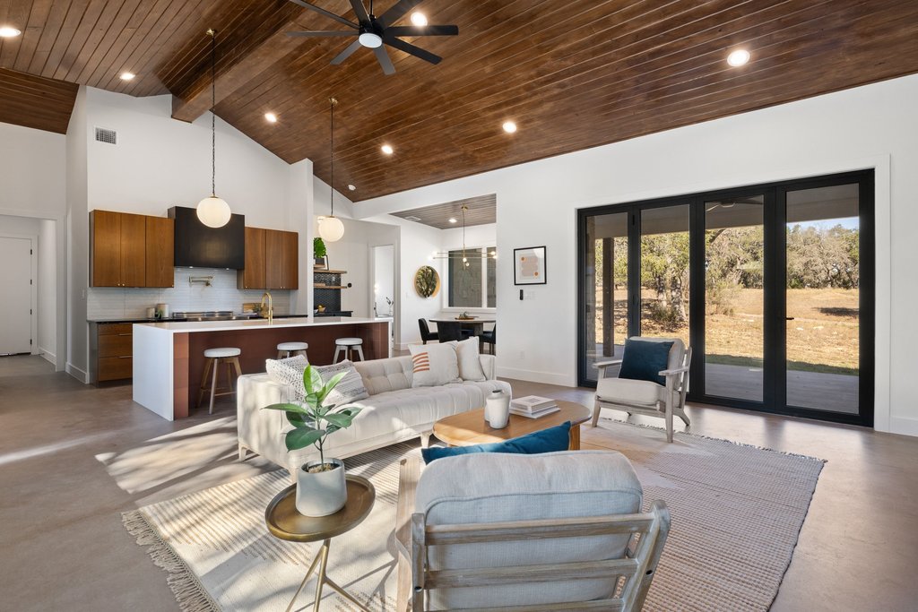 47 War Bonnet Wimberley, TX 78676 - Photo 13 of 40 a living room with stainless steel appliances furniture a rug and a kitchen view