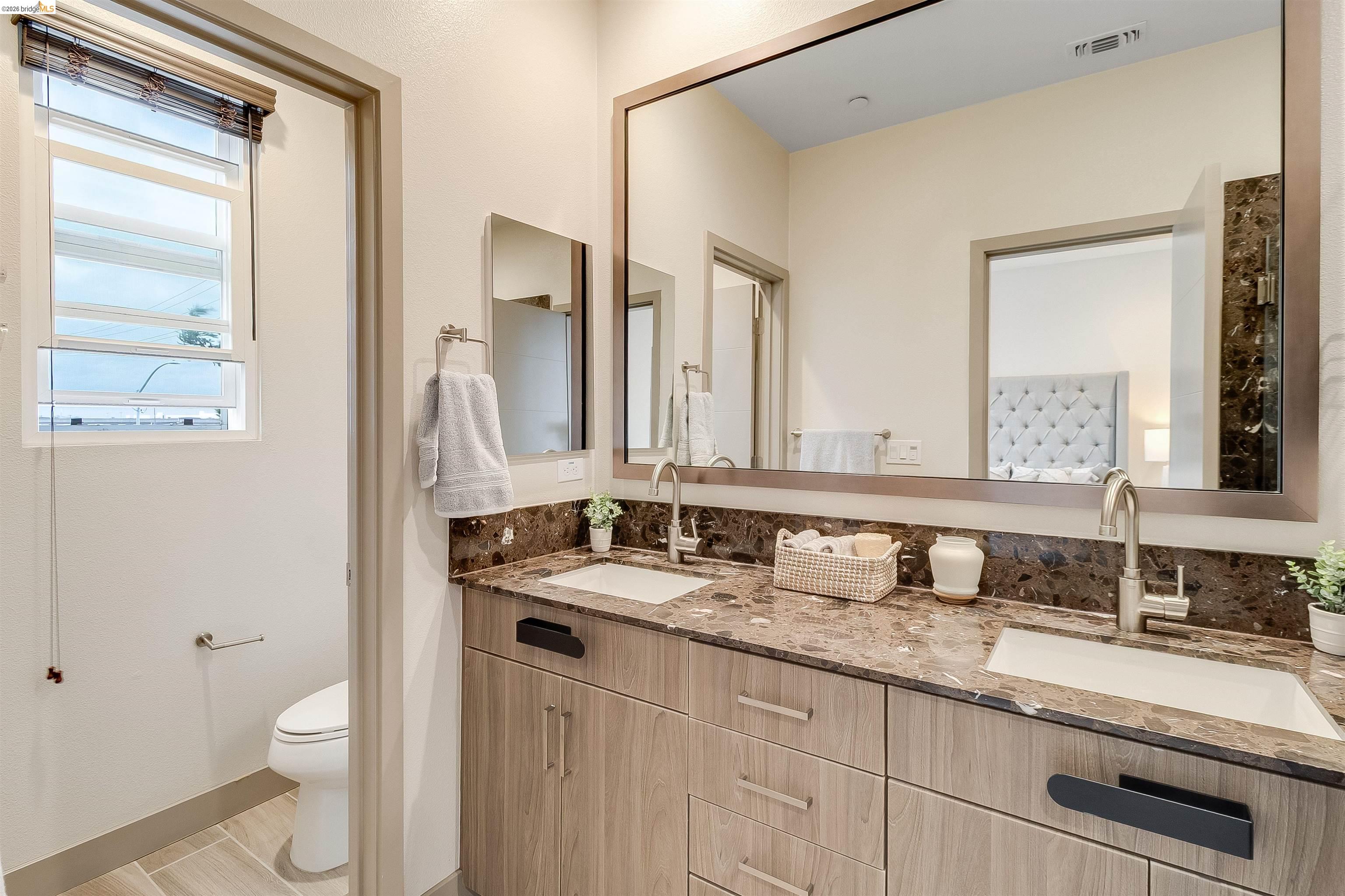 1357 Pullman Way Oakland, CA 94607 - Photo 26 of 37 Dual vanity with integrated sinks and wood-finish cabinetry