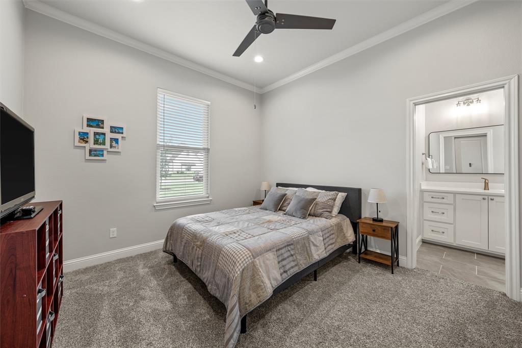 624 Lindsay Lane Robinson, TX 76706 - Photo 15 of 39 a bedroom with a bed and a flat screen tv