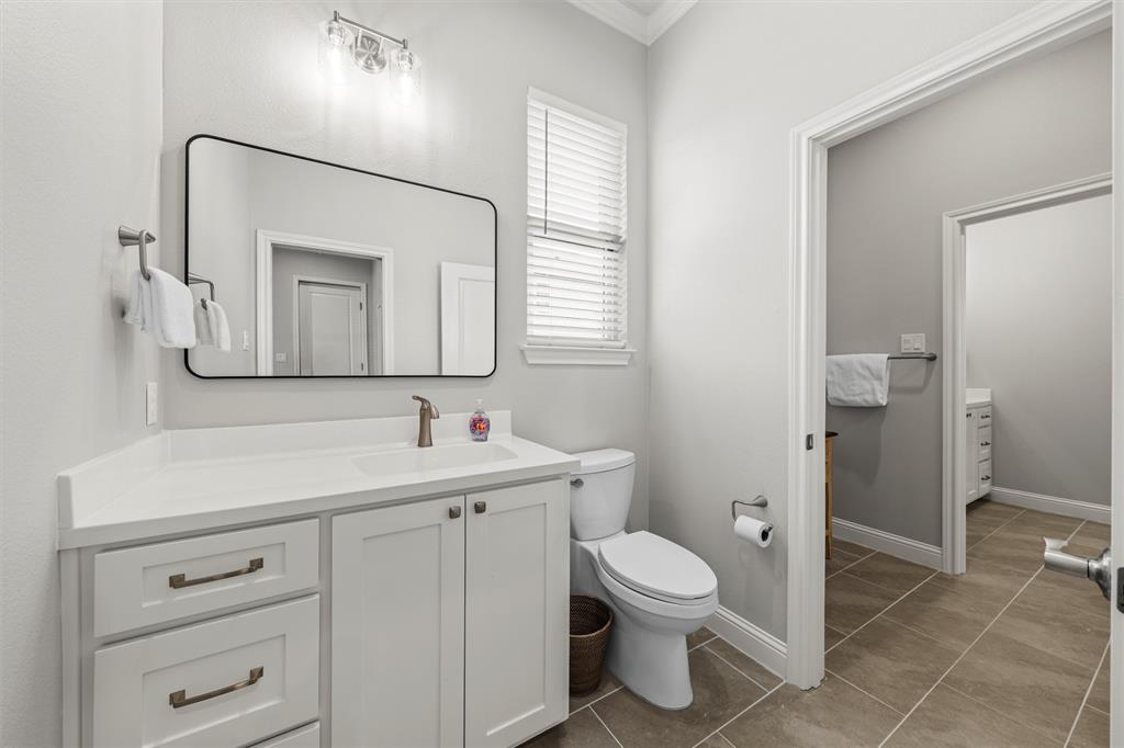 624 Lindsay Lane Robinson, TX 76706 - Photo 16 of 39 a bathroom with a toilet sink and mirror