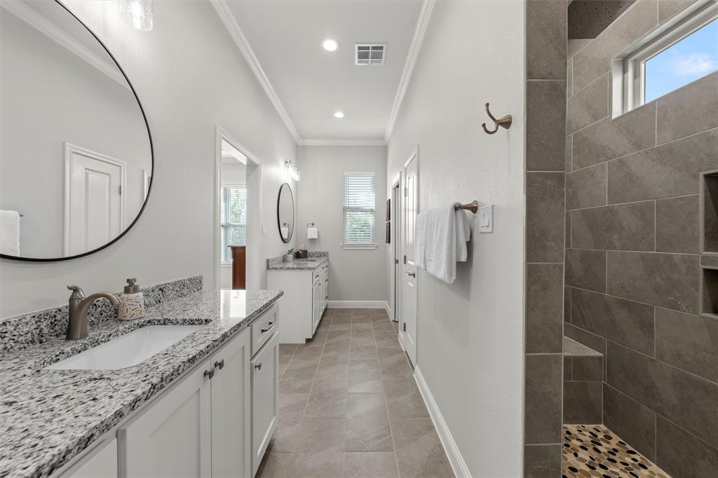 624 Lindsay Lane Robinson, TX 76706 - Photo 23 of 39 a spacious bathroom with a granite countertop sink mirror and shower
