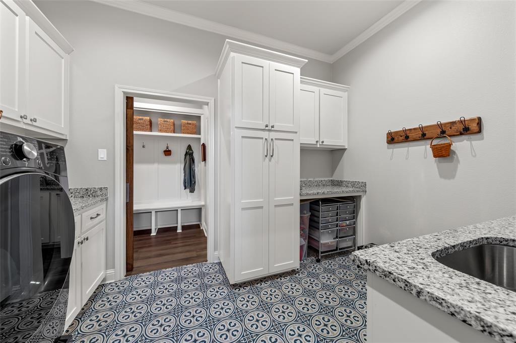 624 Lindsay Lane Robinson, TX 76706 - Photo 26 of 39 a kitchen with a refrigerator and a sink