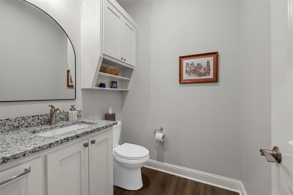 624 Lindsay Lane Robinson, TX 76706 - Photo 27 of 39 a bathroom with a granite countertop toilet sink and mirror