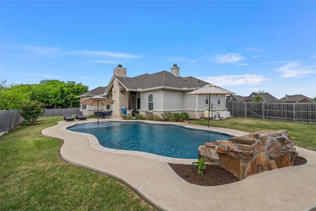 624 Lindsay Lane Robinson, TX 76706 - Photo 32 of 39 a view of a house with swimming pool and a yard