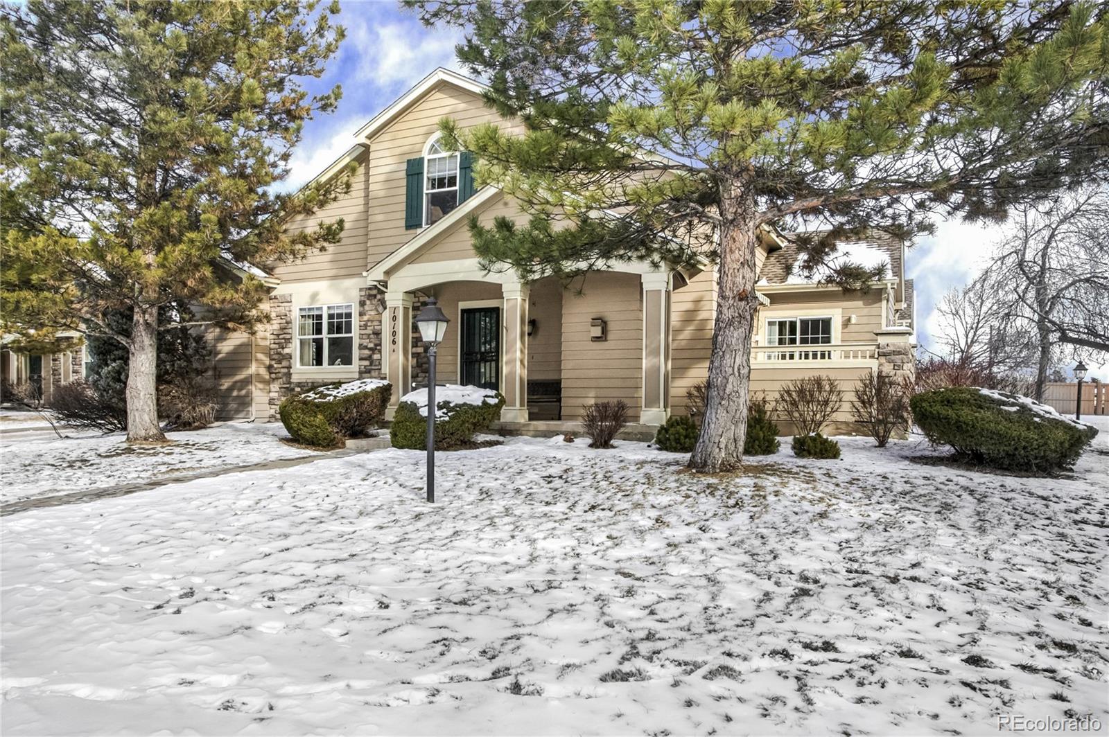 a house with a bench in front of house