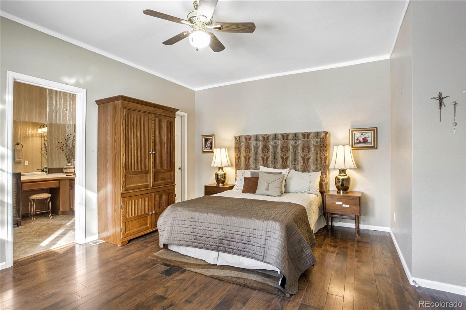10106 North Grove Loop, Unit A Westminster, CO 80031 - Photo 12 of 33 a bedroom with a bed and wooden floor