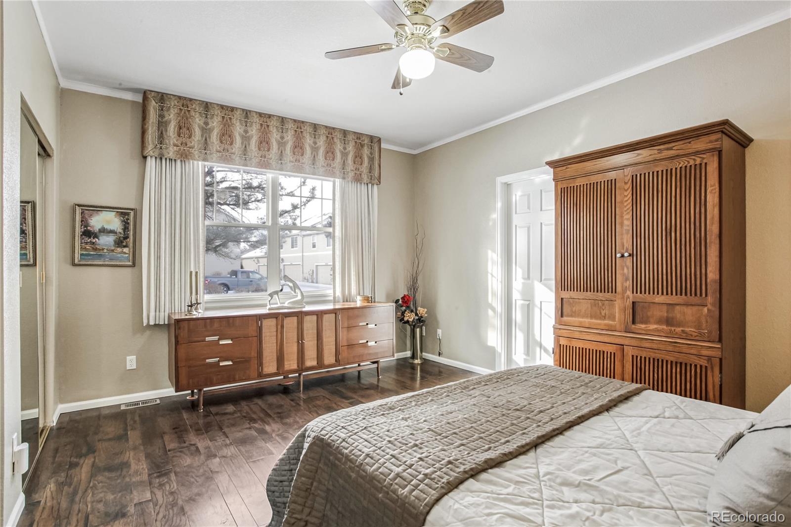 10106 North Grove Loop, Unit A Westminster, CO 80031 - Photo 13 of 33 a bedroom with a bed and a window