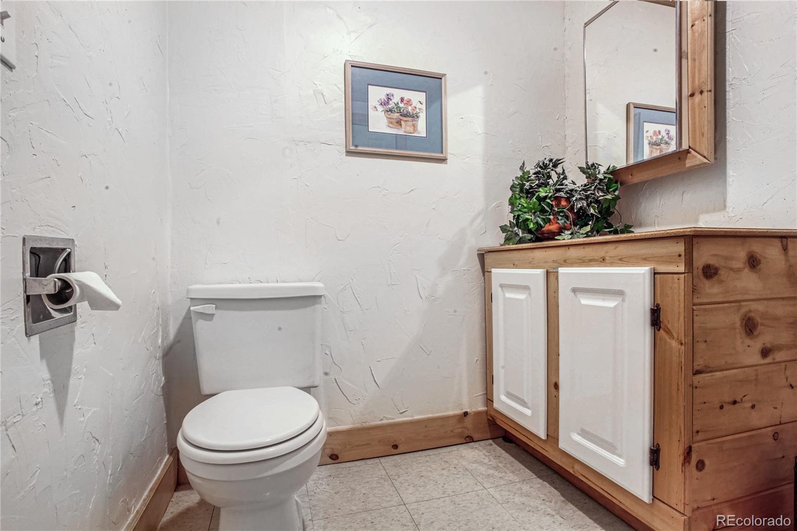10106 North Grove Loop, Unit A Westminster, CO 80031 - Photo 27 of 33 a bathroom with a toilet and a shower
