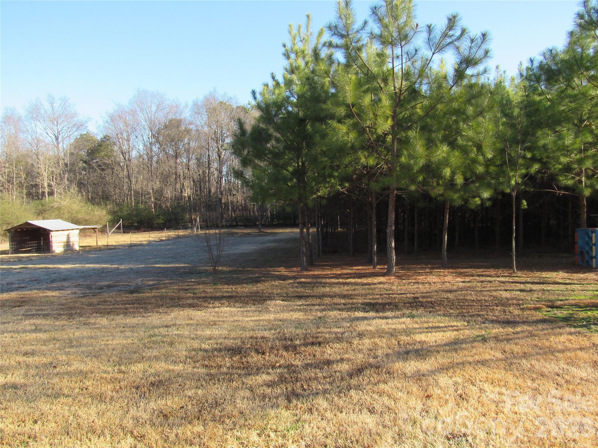 6825 Nance-Tarlton Road Marshville, NC 28103 - Photo 11 of 34 a view of a backyard with trees