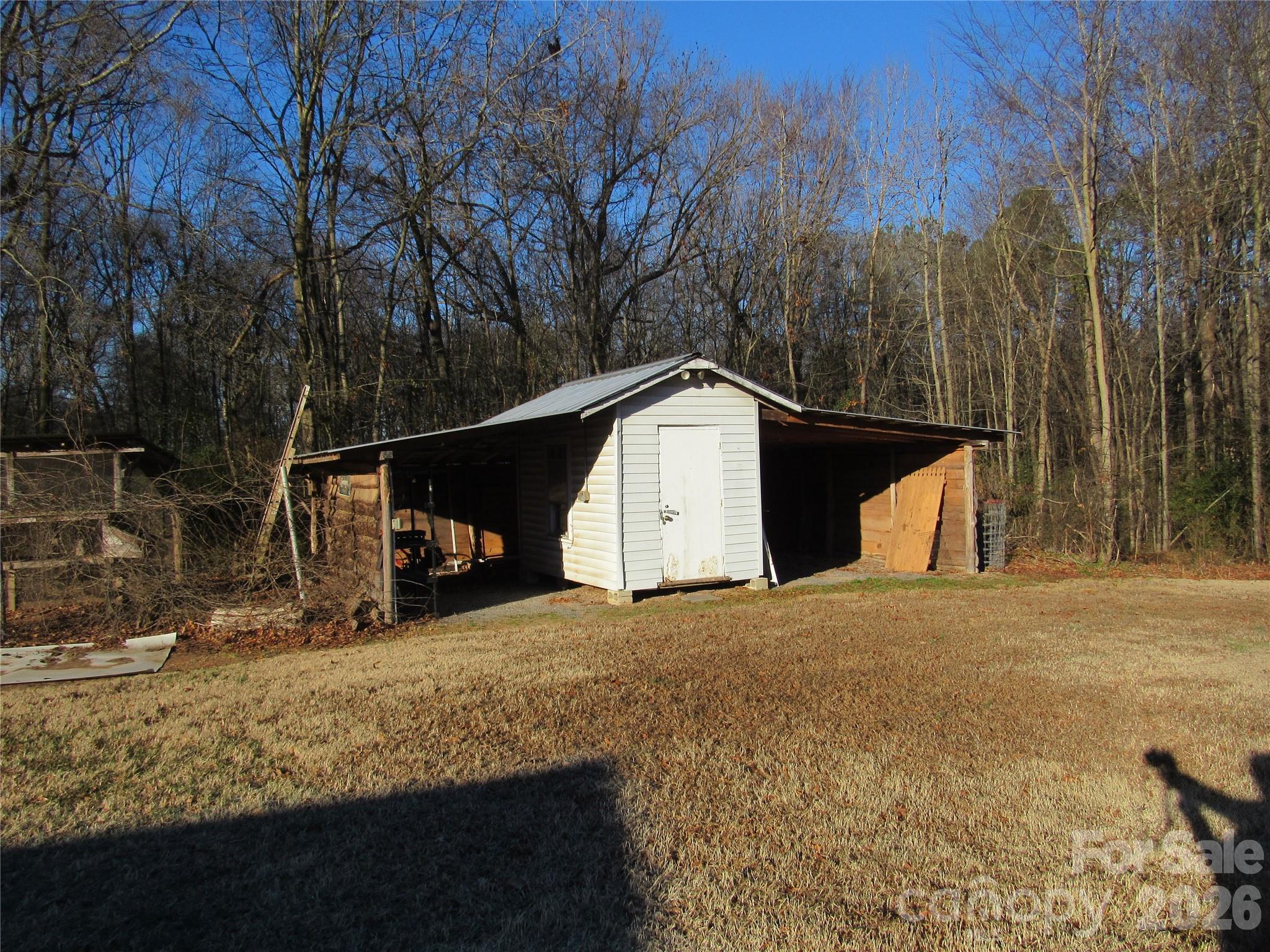 6825 Nance-Tarlton Road Marshville, NC 28103 - Photo 13 of 34 a view of a house with a snow covered by side of the road