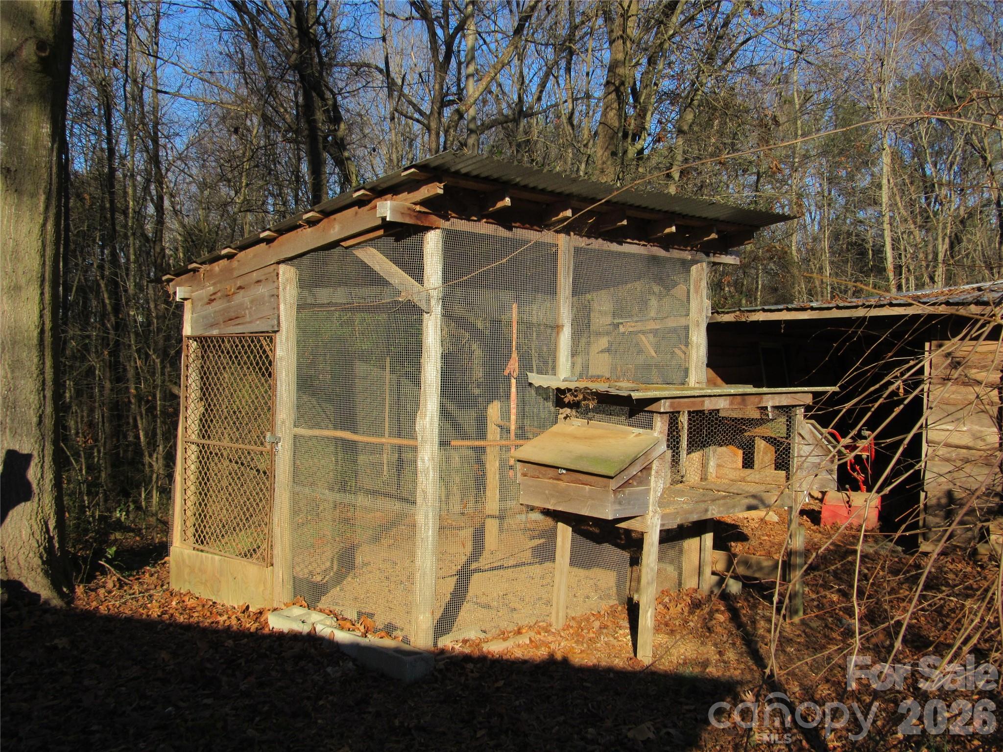 6825 Nance-Tarlton Road Marshville, NC 28103 - Photo 14 of 34 a yellow house with trees in front of it