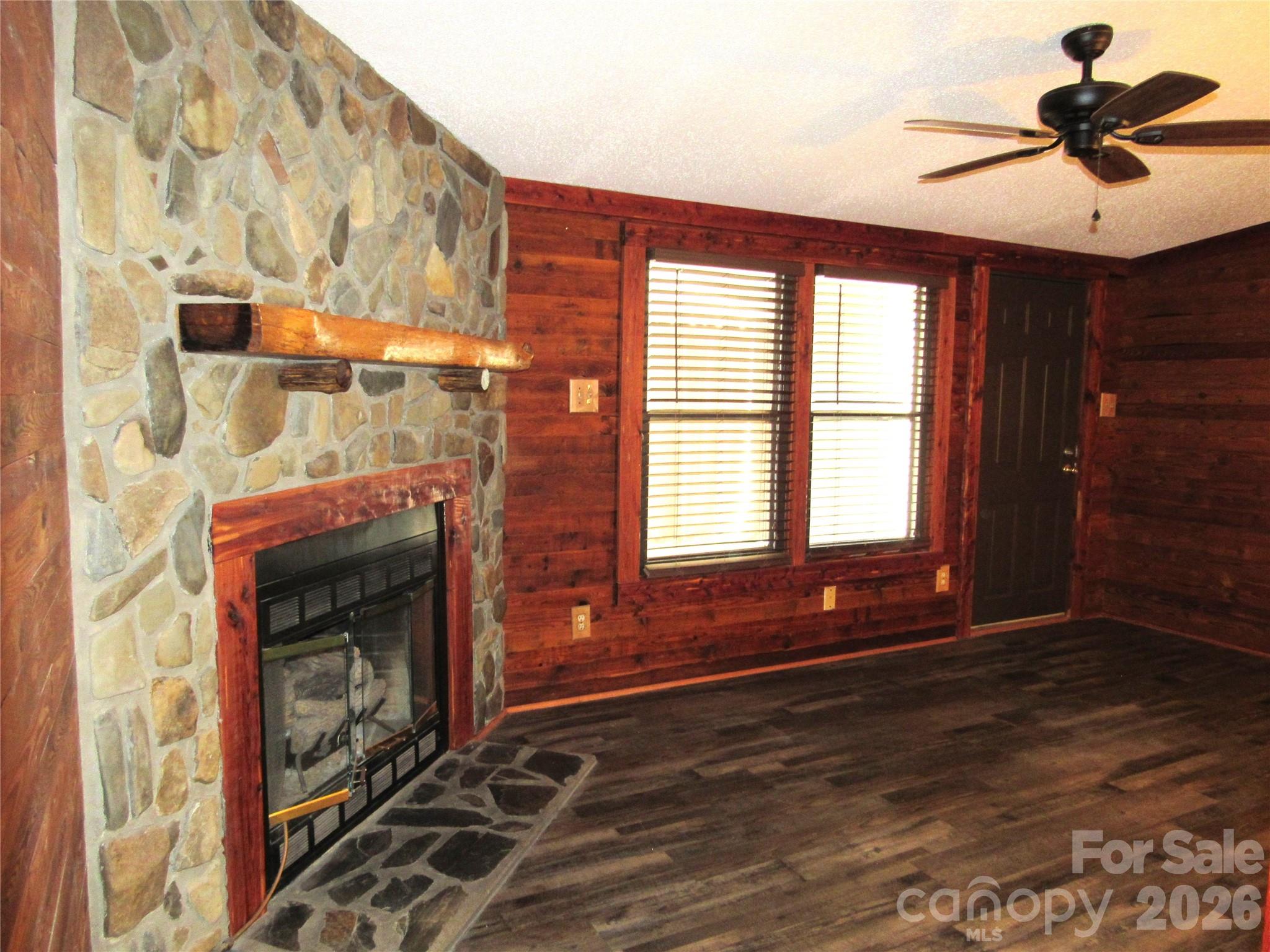 6825 Nance-Tarlton Road Marshville, NC 28103 - Photo 16 of 34 a living room with a fireplace and a window