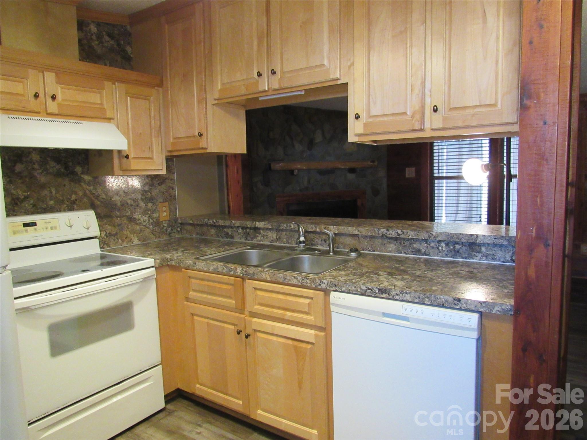 6825 Nance-Tarlton Road Marshville, NC 28103 - Photo 19 of 34 a kitchen with granite countertop white cabinets and stainless steel appliances