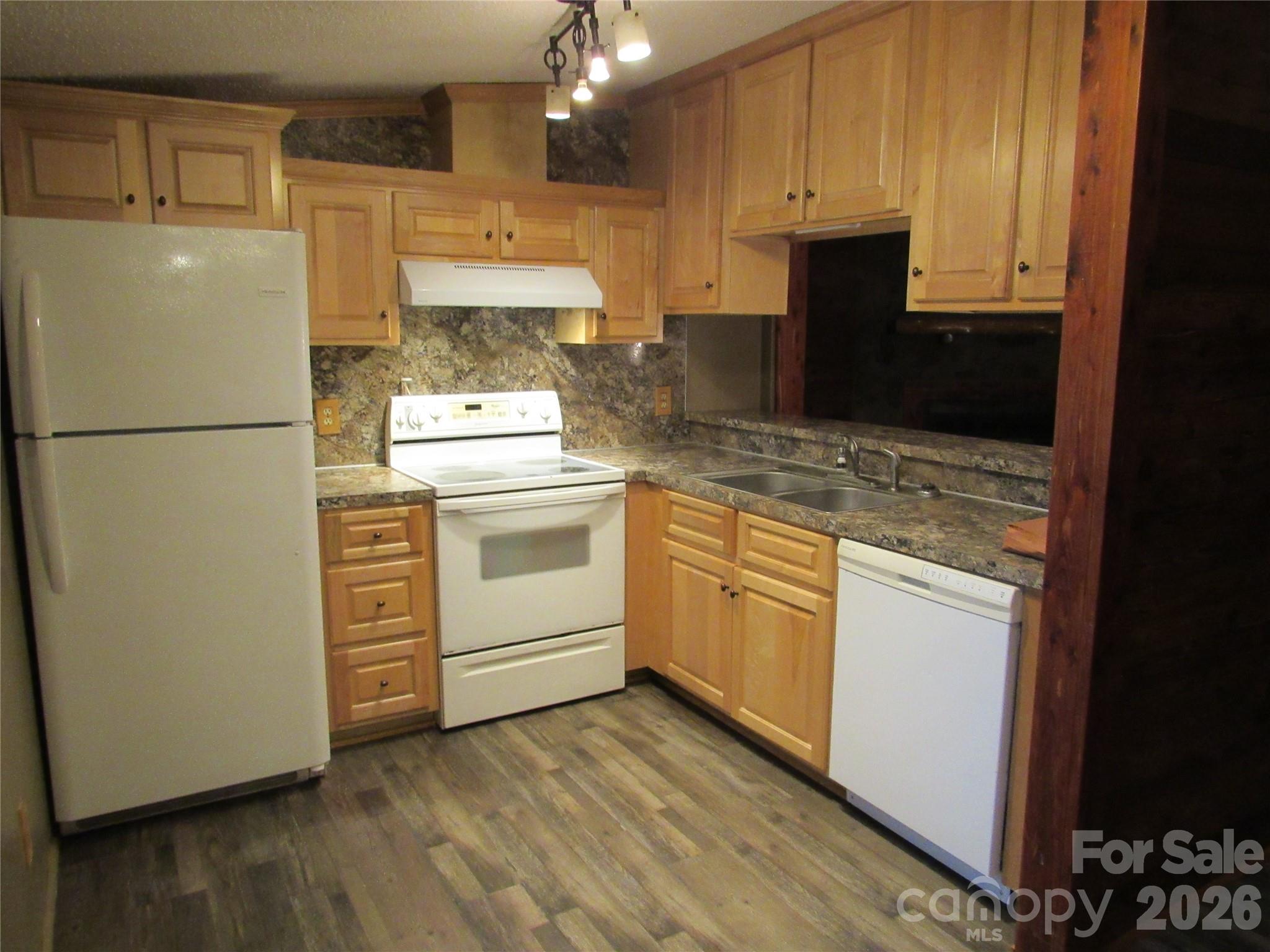 6825 Nance-Tarlton Road Marshville, NC 28103 - Photo 20 of 34 a kitchen with granite countertop white cabinets and refrigerator