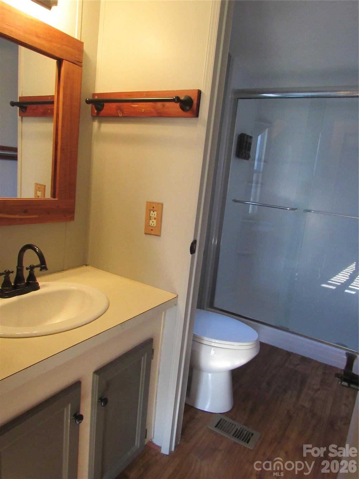 6825 Nance-Tarlton Road Marshville, NC 28103 - Photo 23 of 34 a bathroom with a sink a toilet and a mirror