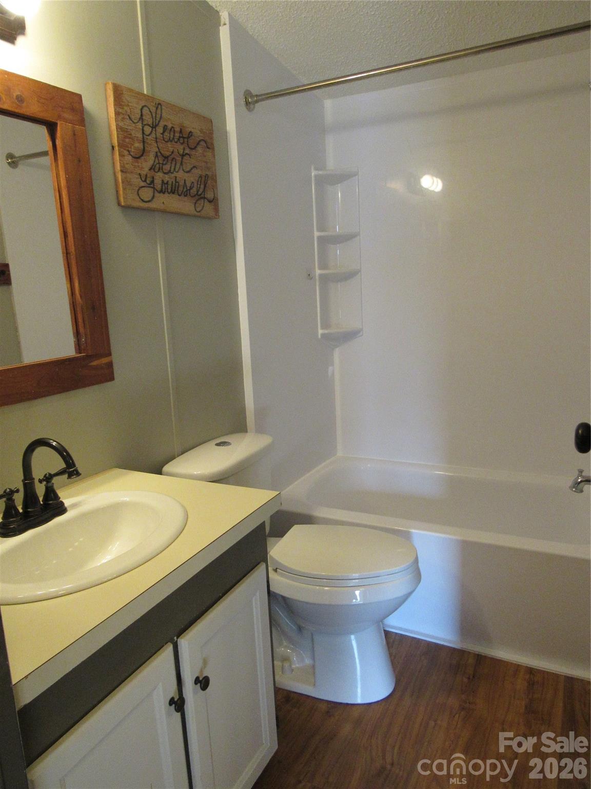 6825 Nance-Tarlton Road Marshville, NC 28103 - Photo 26 of 34 a bathroom with a sink a toilet and shower