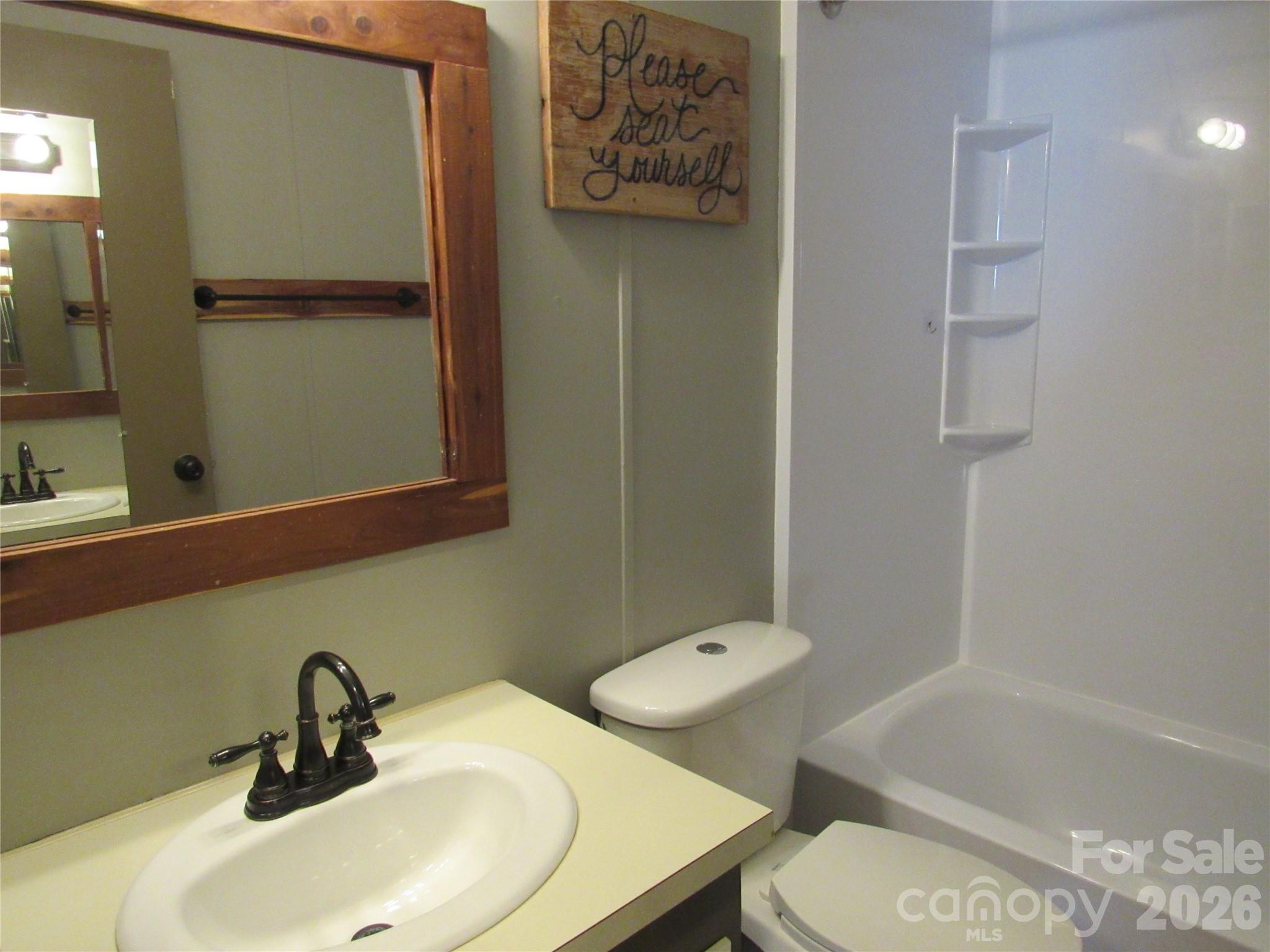 6825 Nance-Tarlton Road Marshville, NC 28103 - Photo 27 of 34 a bathroom with a sink toilet and shower
