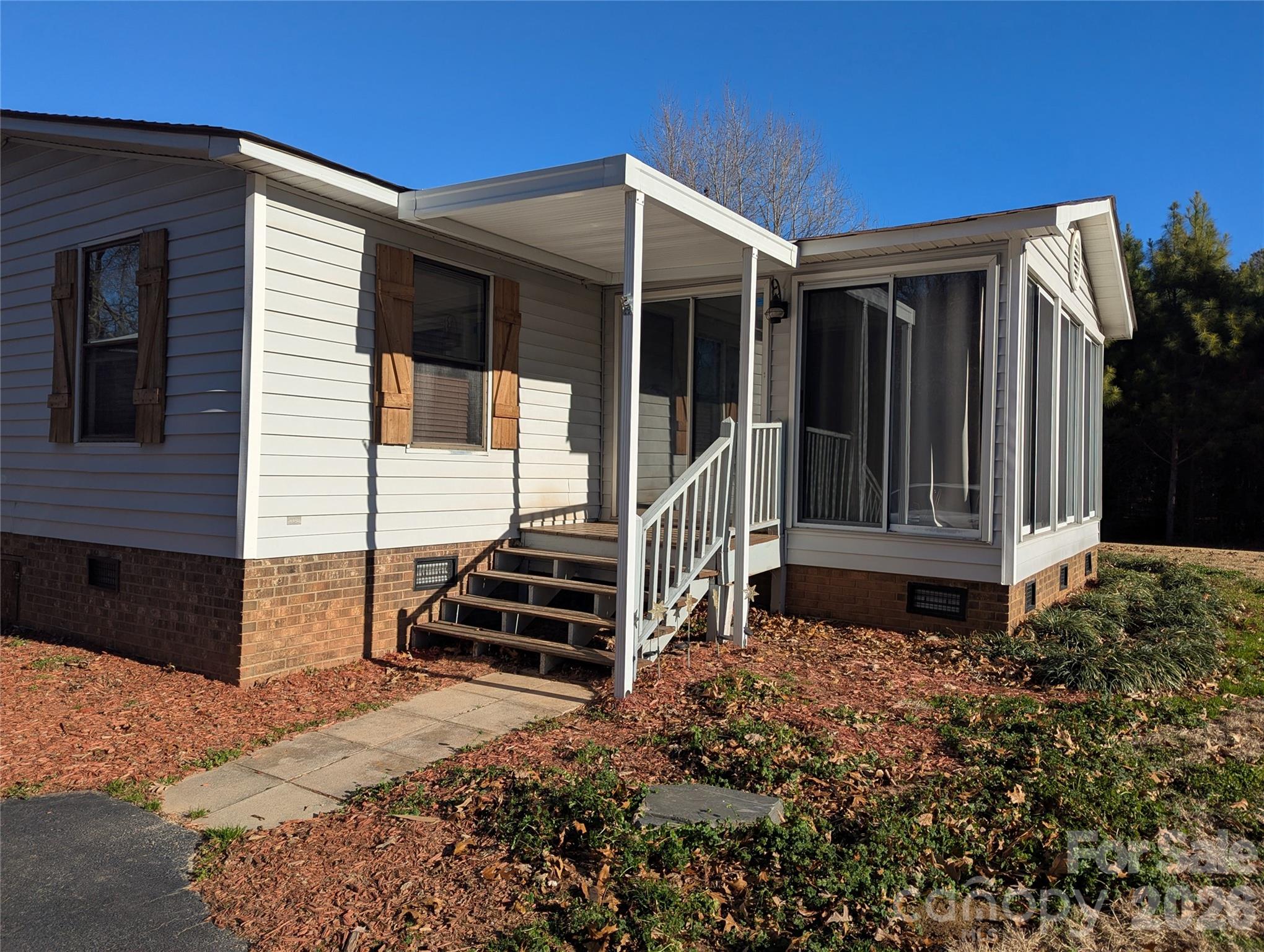 6825 Nance-Tarlton Road Marshville, NC 28103 - Photo 3 of 34 a front view of a house with a yard
