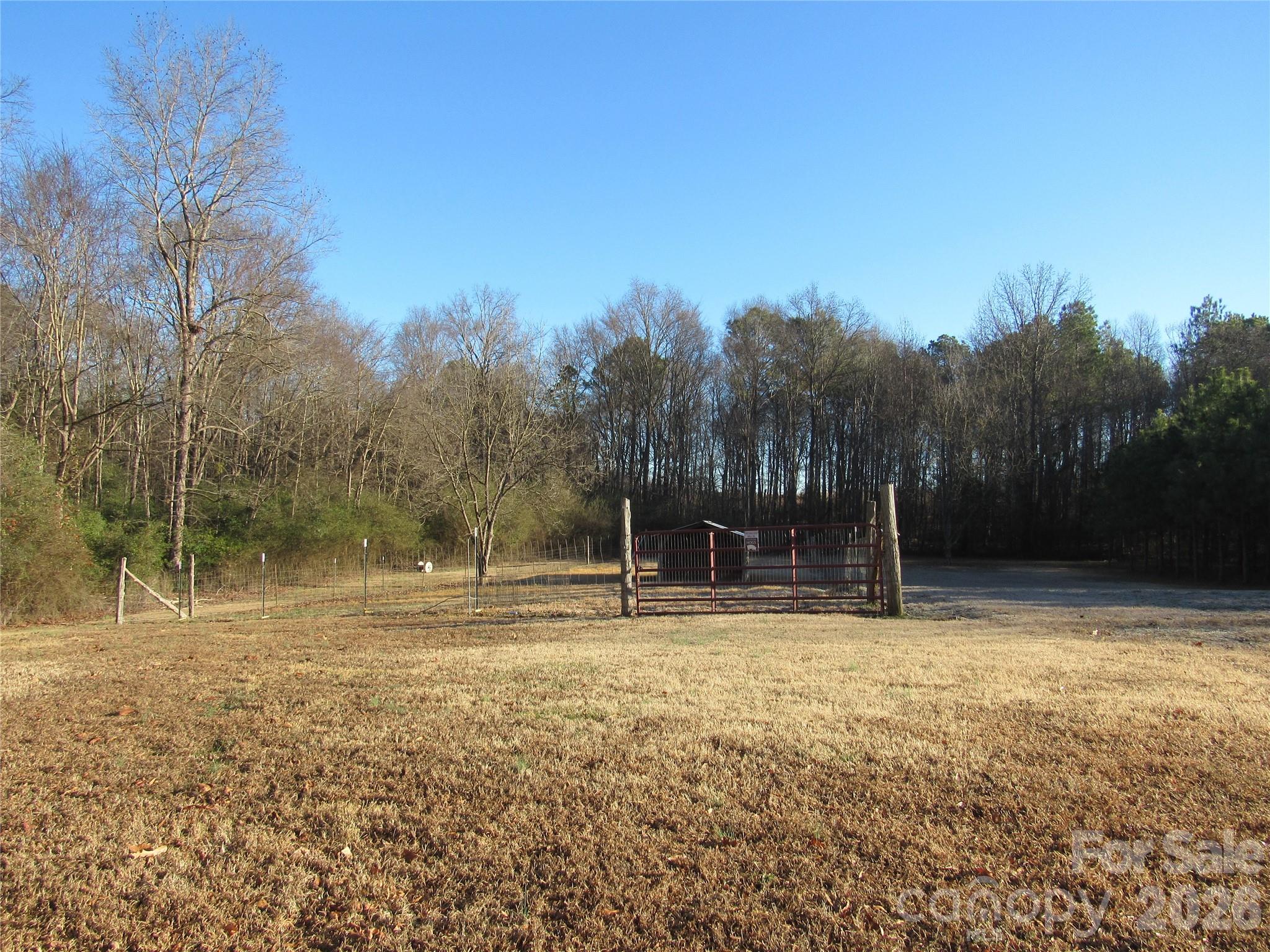 6825 Nance-Tarlton Road Marshville, NC 28103 - Photo 9 of 34 a view of outdoor space with trees all around