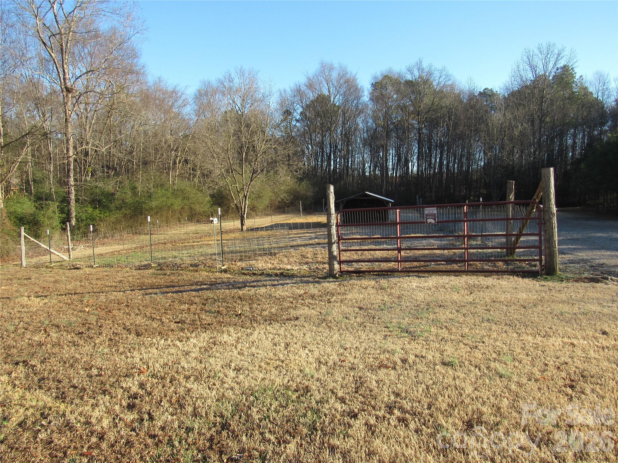 6825 Nance-Tarlton Road Marshville, NC 28103 - Photo 10 of 34 a view of a backyard with green space