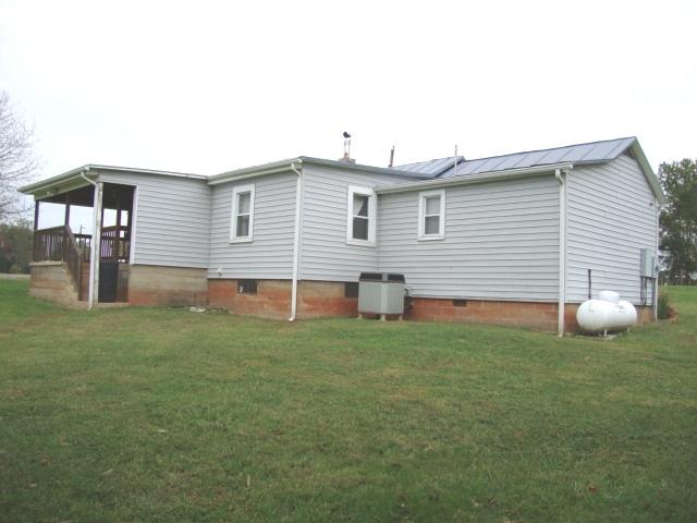 7891 Dickerson Mill Road Moneta, VA 24121 - Photo 10 of 17 Back of home - heat pump