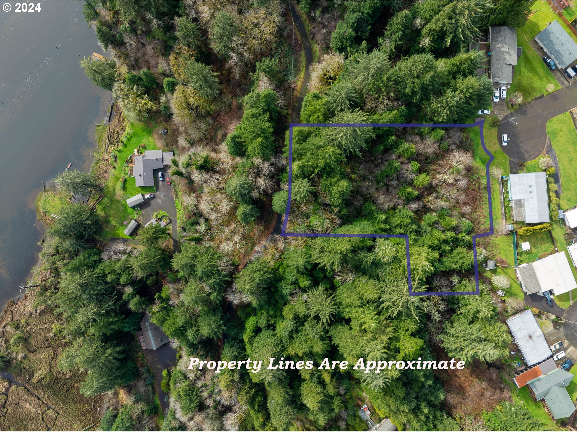 Crestview Drive Reedsport, OR 97467 - Photo 2 of 6 an aerial view of a house with a yard