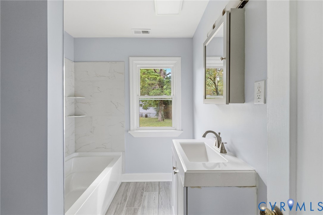 5901 Bonneau Road Richmond, VA 23227 - Photo 13 of 21 Bathroom with a built-in tub/shower combination, i