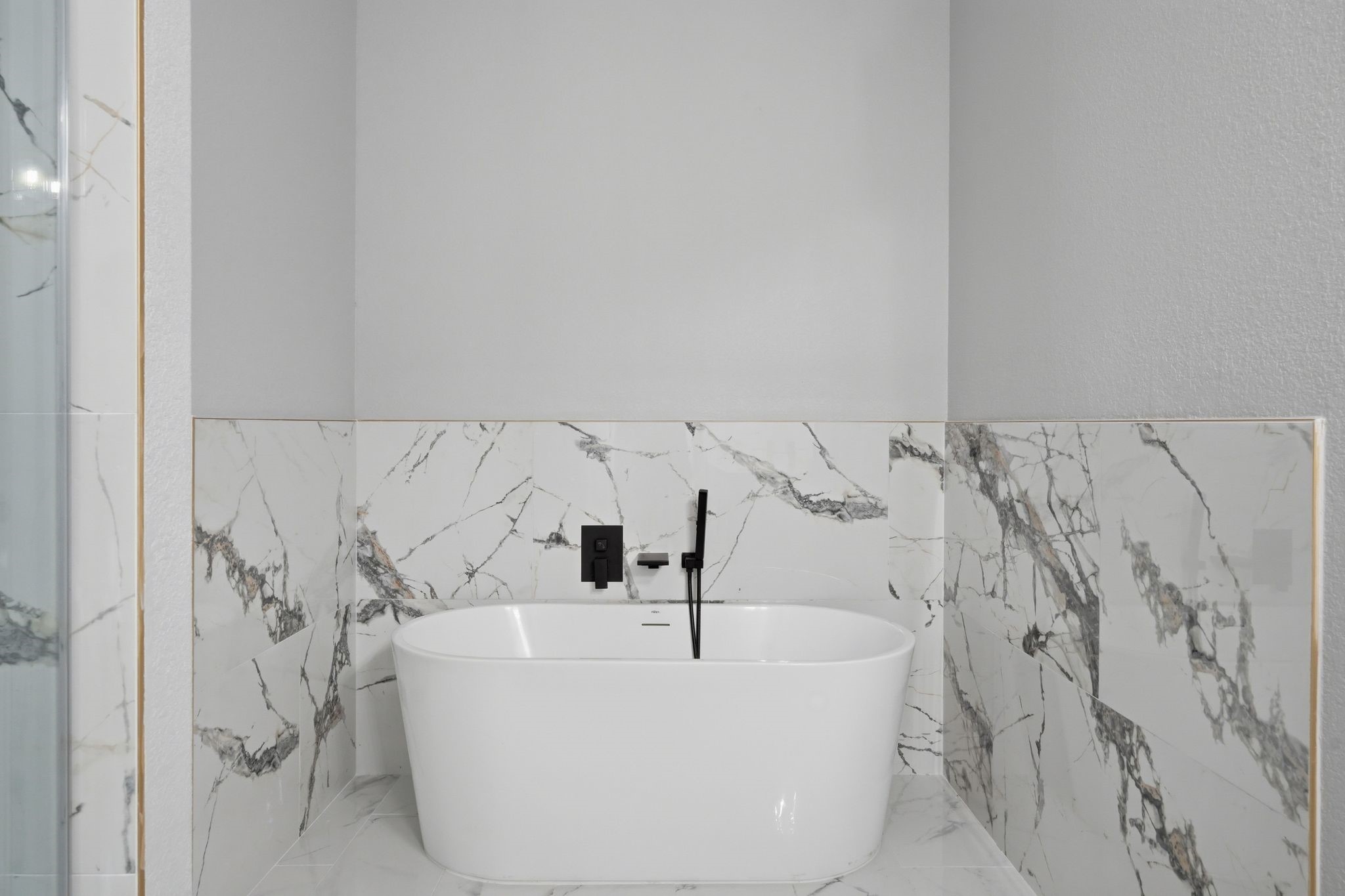 3575 Roy Bean Road Willis, TX 77378 - Photo 23 of 40 a white bath tub sitting in a bathroom