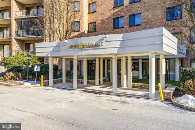 a view of a building with sitting area