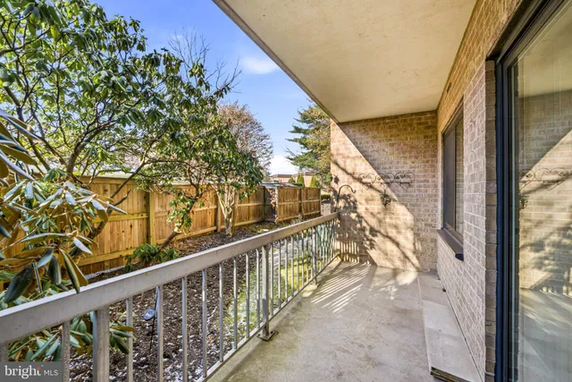 a view of a balcony with wooden stairs