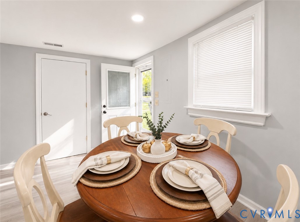 110 Locust Grove Cartersville, VA 23027 - Photo 16 of 26 a dining room with table and chairs