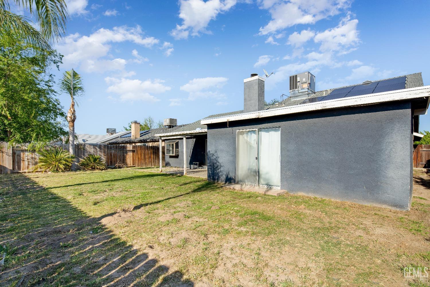 Undisclosed Address Bakersfield, CA 93313 - Photo 16 of 17 a view of a house with a yard