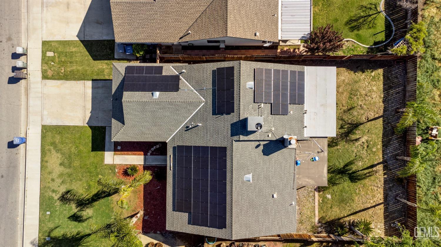 Undisclosed Address Bakersfield, CA 93313 - Photo 17 of 17 an aerial view of a house with swimming pool and wooden fence