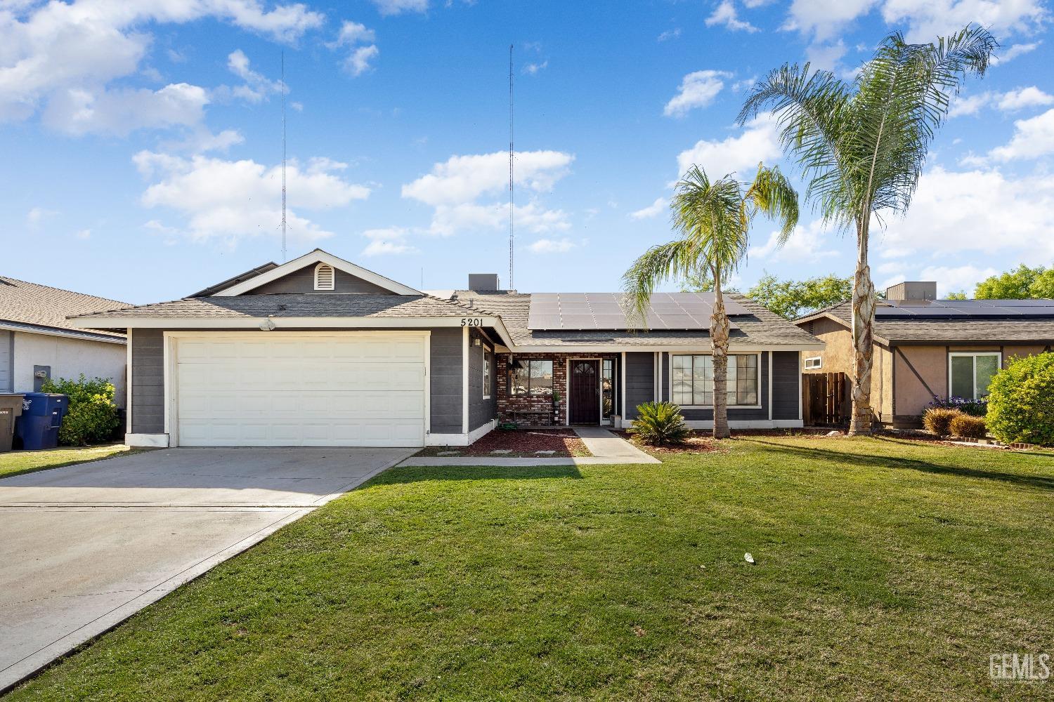 Undisclosed Address Bakersfield, CA 93313 - Photo 2 of 17 a view of a house with a yard and potted plants