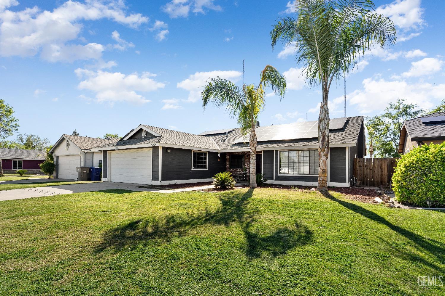 Undisclosed Address Bakersfield, CA 93313 - Photo 4 of 17 a view of a house with a swimming pool and a yard