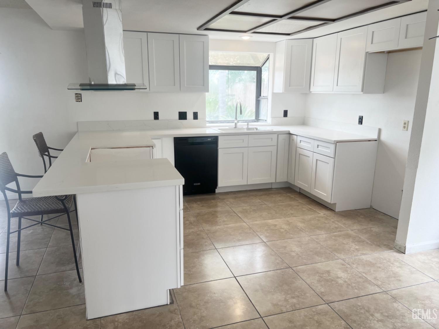 Undisclosed Address Bakersfield, CA 93313 - Photo 7 of 17 a kitchen with a sink cabinets and window