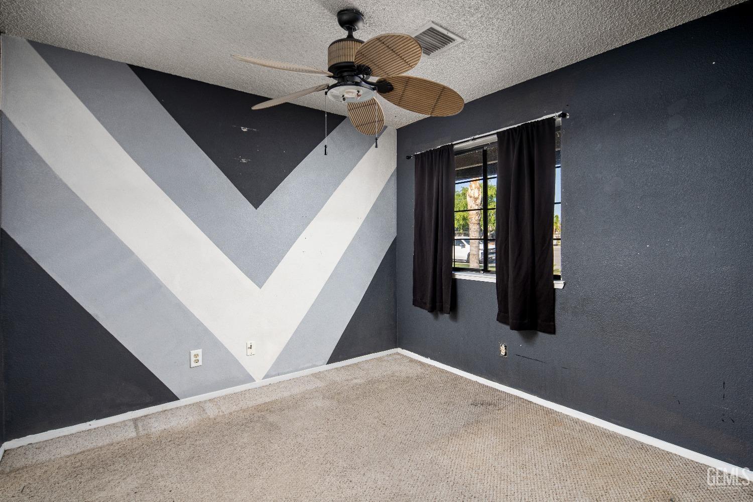 Undisclosed Address Bakersfield, CA 93313 - Photo 10 of 17 a view of a livingroom with a staircase