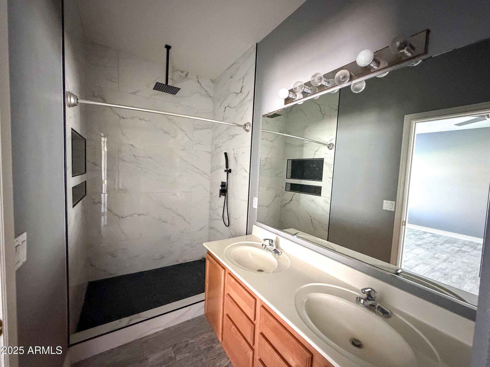 982 East Doris Street Avondale, AZ 85323 - Photo 11 of 17 a bathroom with a sink and a mirror
