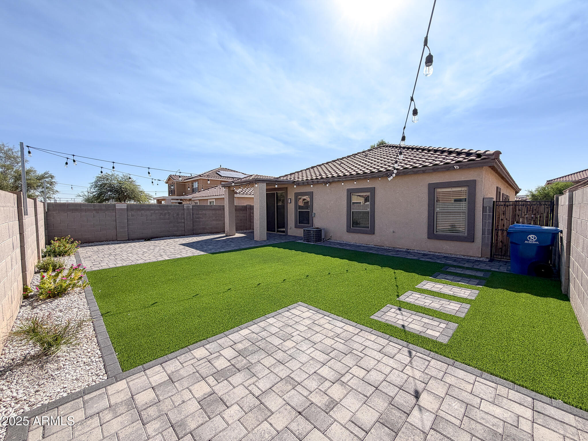 982 East Doris Street Avondale, AZ 85323 - Photo 2 of 17 a front view of a house with a garden and yard