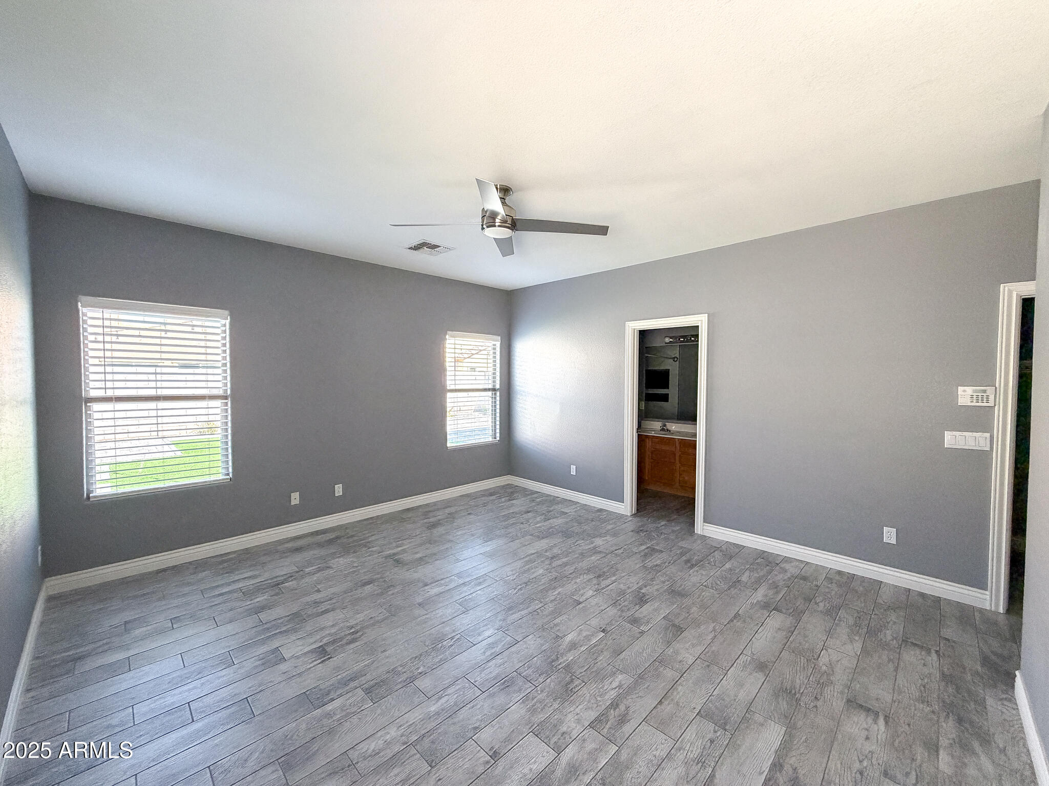 982 East Doris Street Avondale, AZ 85323 - Photo 10 of 17 a view of an empty room with a window