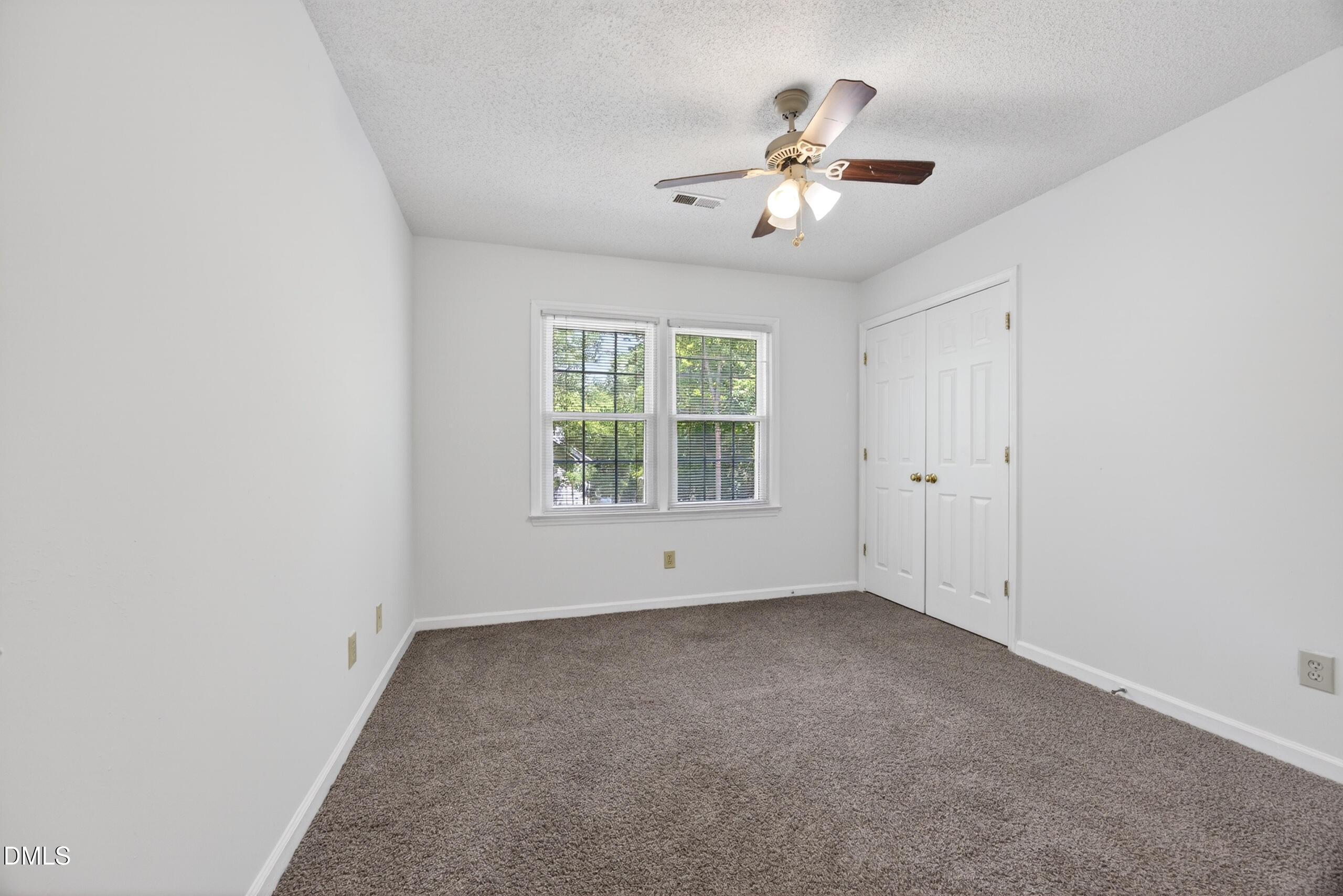 1901 Whites Mill Road High Point, NC 27265 - Photo 14 of 24 an empty room with chandelier fan and windows