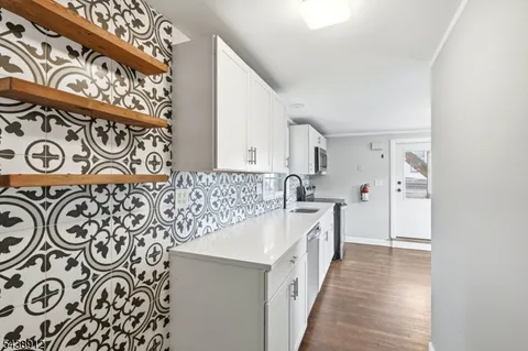 a kitchen with a sink and a stove