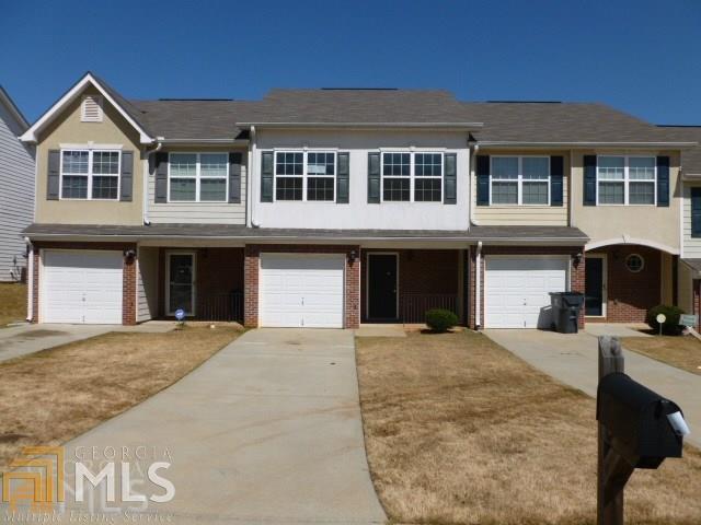 702 Georgetown Court Jonesboro, GA 30236 - Photo 1 of 1 a front view of a house with yard and parking