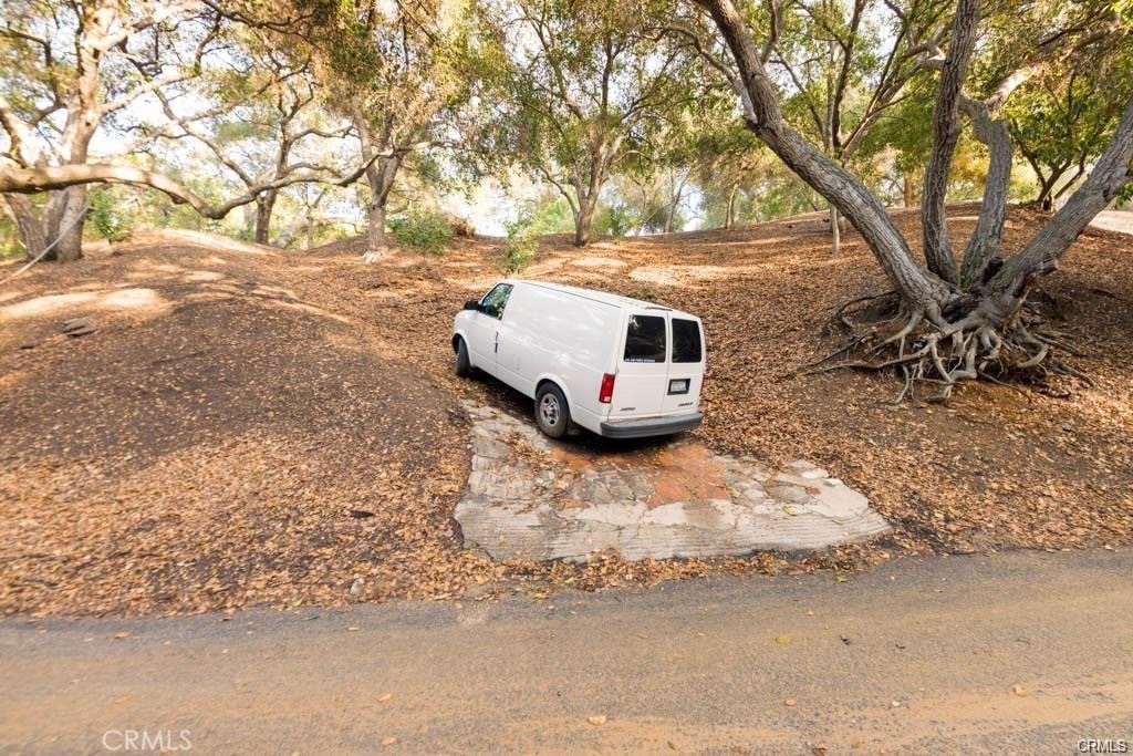 0 Elzevir Road Woodland Hills, CA 91364 - Photo 12 of 30 a white house that has tree in front of it