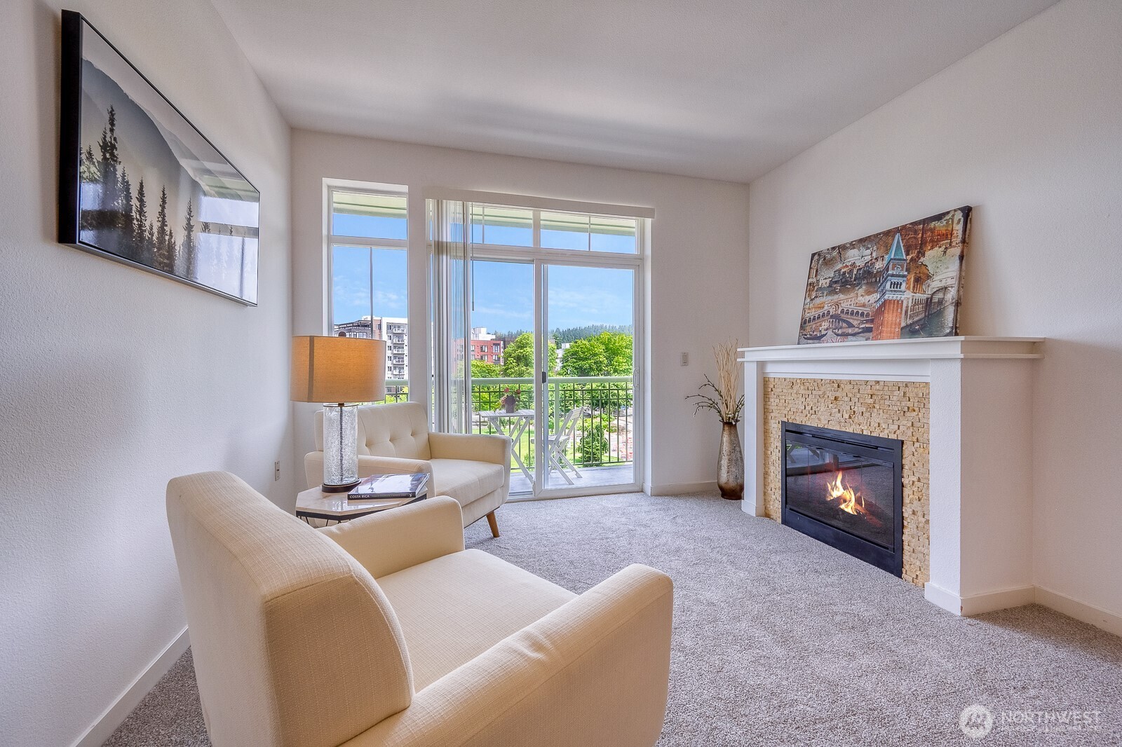 16141 Cleveland Street, Unit 412 Redmond, WA 98052 - Photo 11 of 31 a living room with furniture and a fireplace