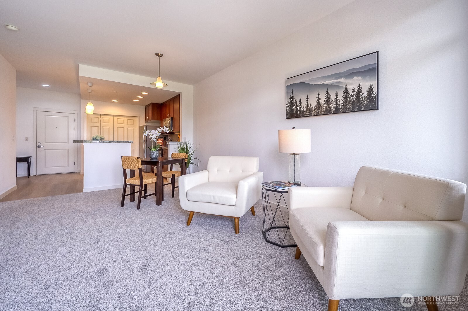 16141 Cleveland Street, Unit 412 Redmond, WA 98052 - Photo 12 of 31 a living room with furniture and a chandelier