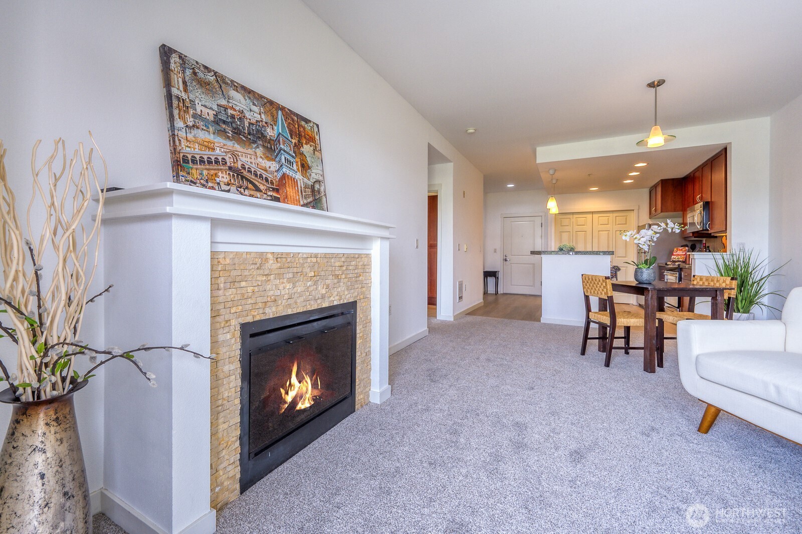 16141 Cleveland Street, Unit 412 Redmond, WA 98052 - Photo 13 of 31 a living room with furniture and a fireplace