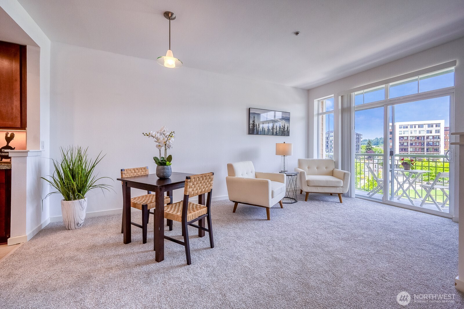 16141 Cleveland Street, Unit 412 Redmond, WA 98052 - Photo 14 of 31 a living room with furniture and a potted plant