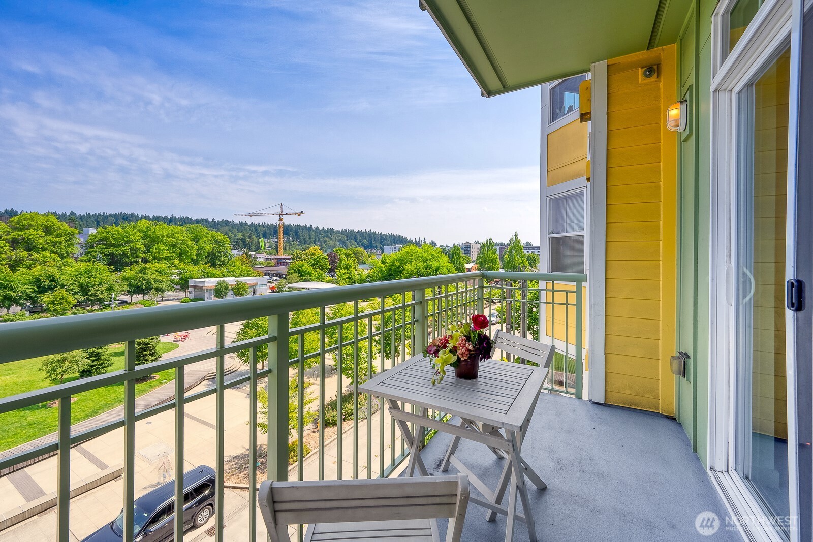 16141 Cleveland Street, Unit 412 Redmond, WA 98052 - Photo 16 of 31 a view of a chairs and table in the balcony