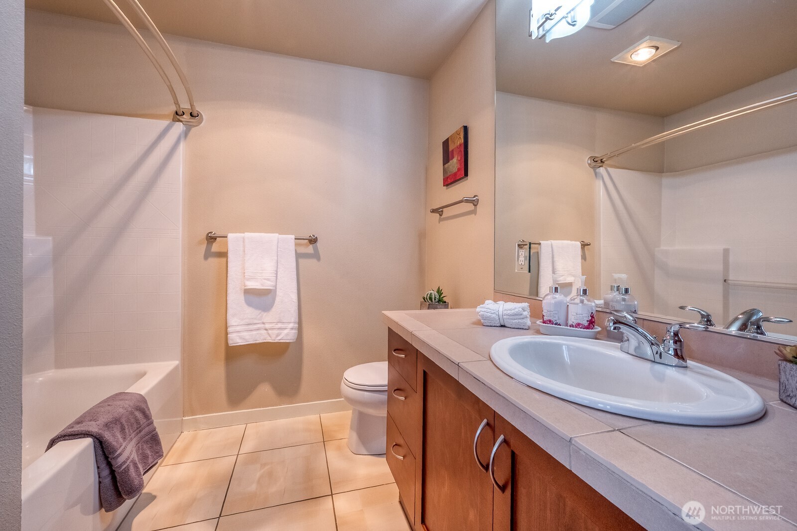 16141 Cleveland Street, Unit 412 Redmond, WA 98052 - Photo 24 of 31 a bathroom with a sink and a mirror